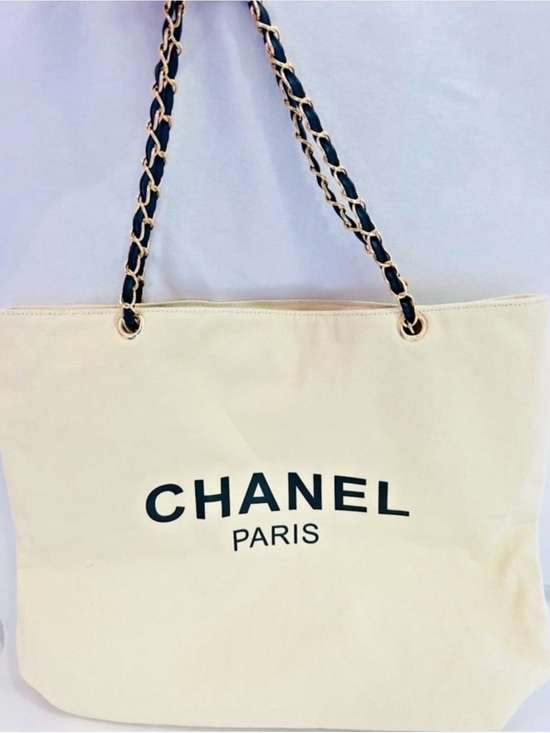 CHANEL Handbags - CHANEL Cream Canvas Tote with Black CC Logo